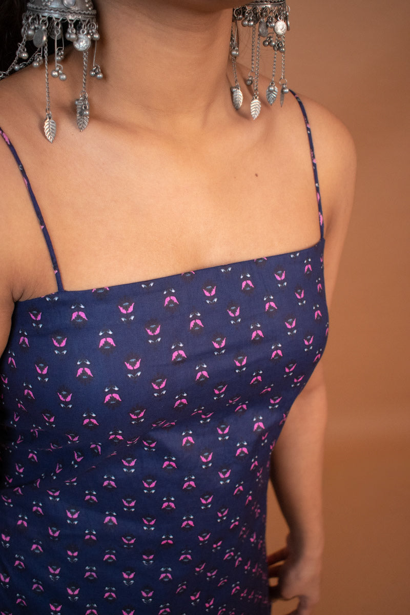 Jiva-Blue floral pattern worn by a person against a brown background