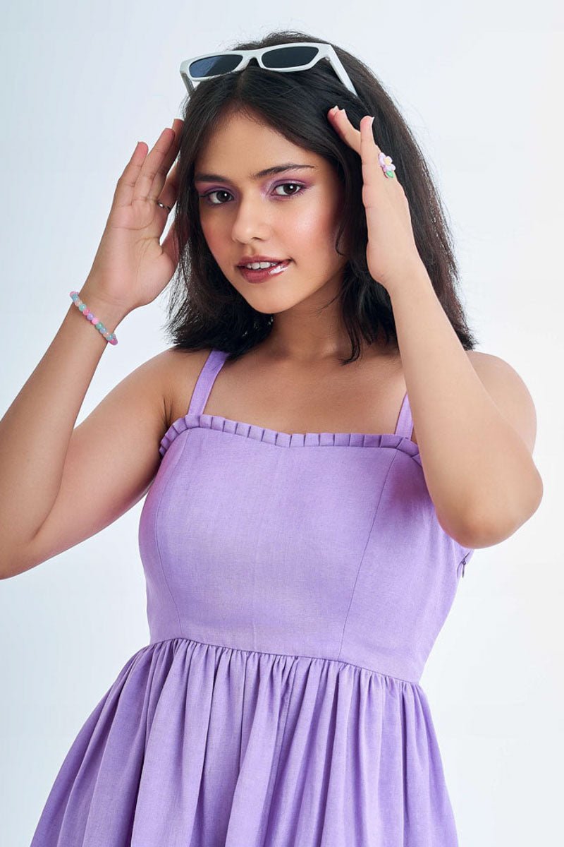 Person wearing a vibrant loungewear lavender dress